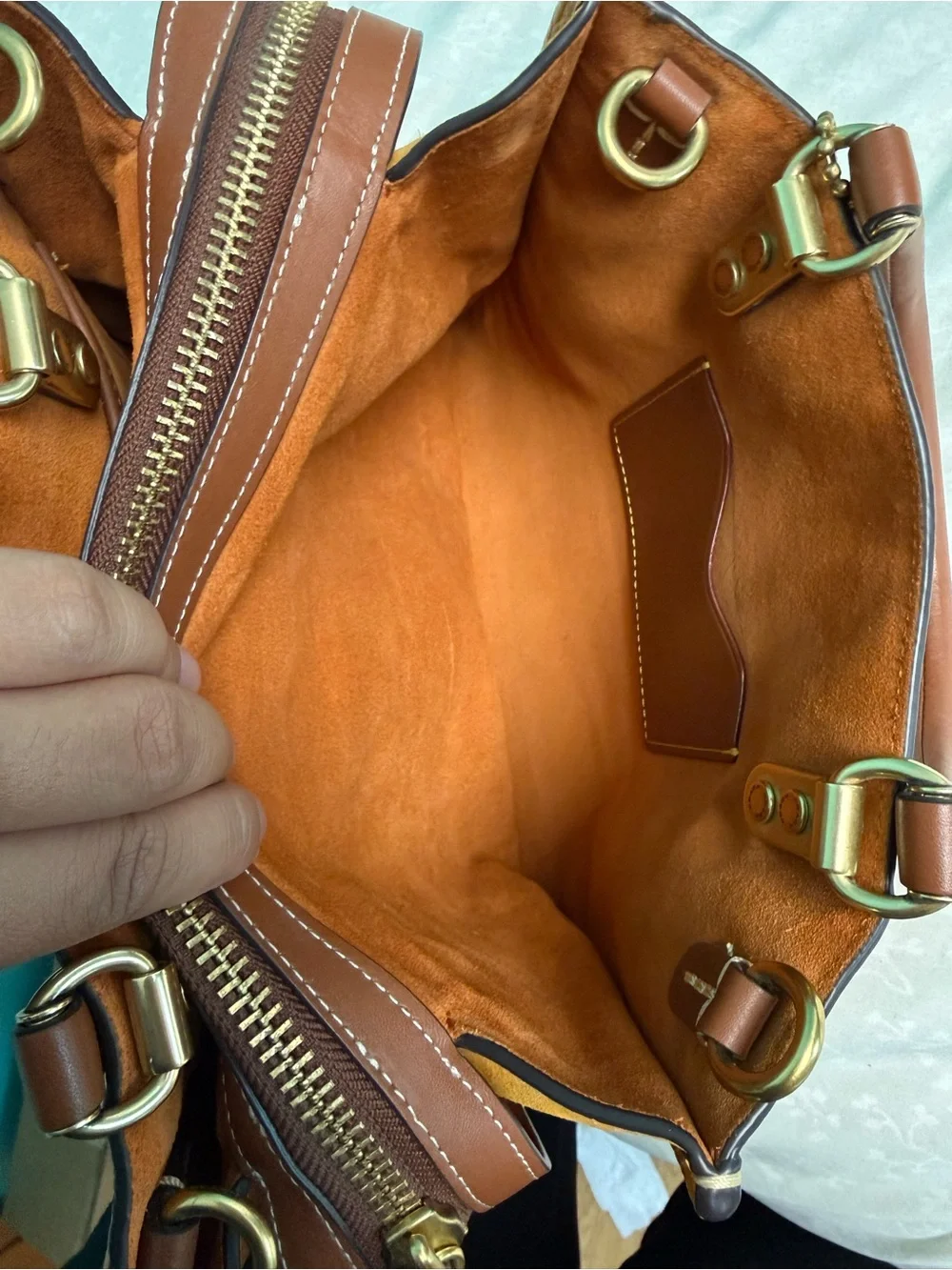 Coach Pebbled rouge 25 in papaya orange
